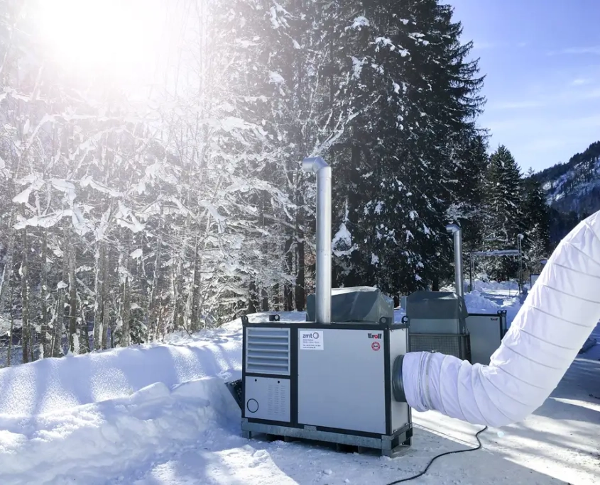 Large output Indirect warm air heater for temporary or permanent heating applications – shown here working externally in very cold weather conditions warming a temporary structure from Flexiheat UK