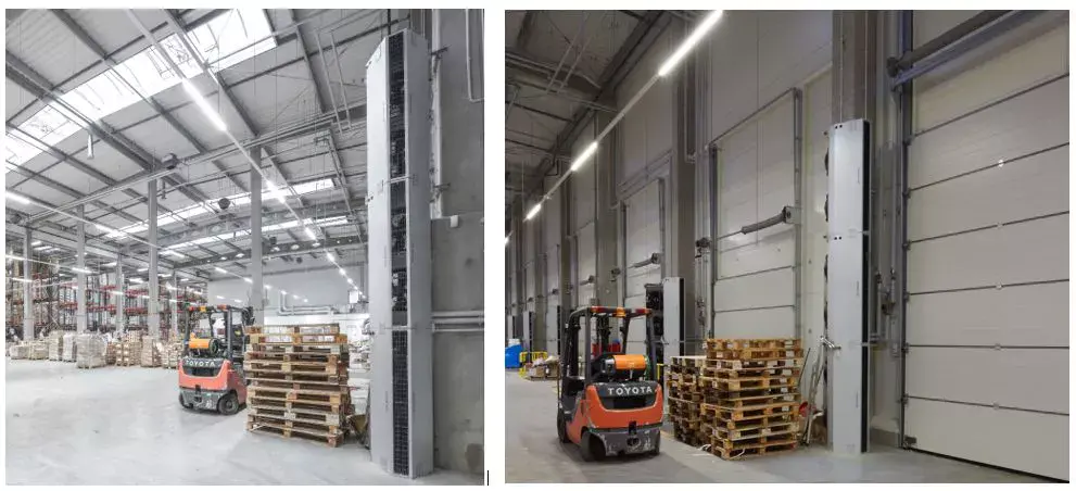 Vertically installed industrial air curtains installation picture in a warehouse for a factory